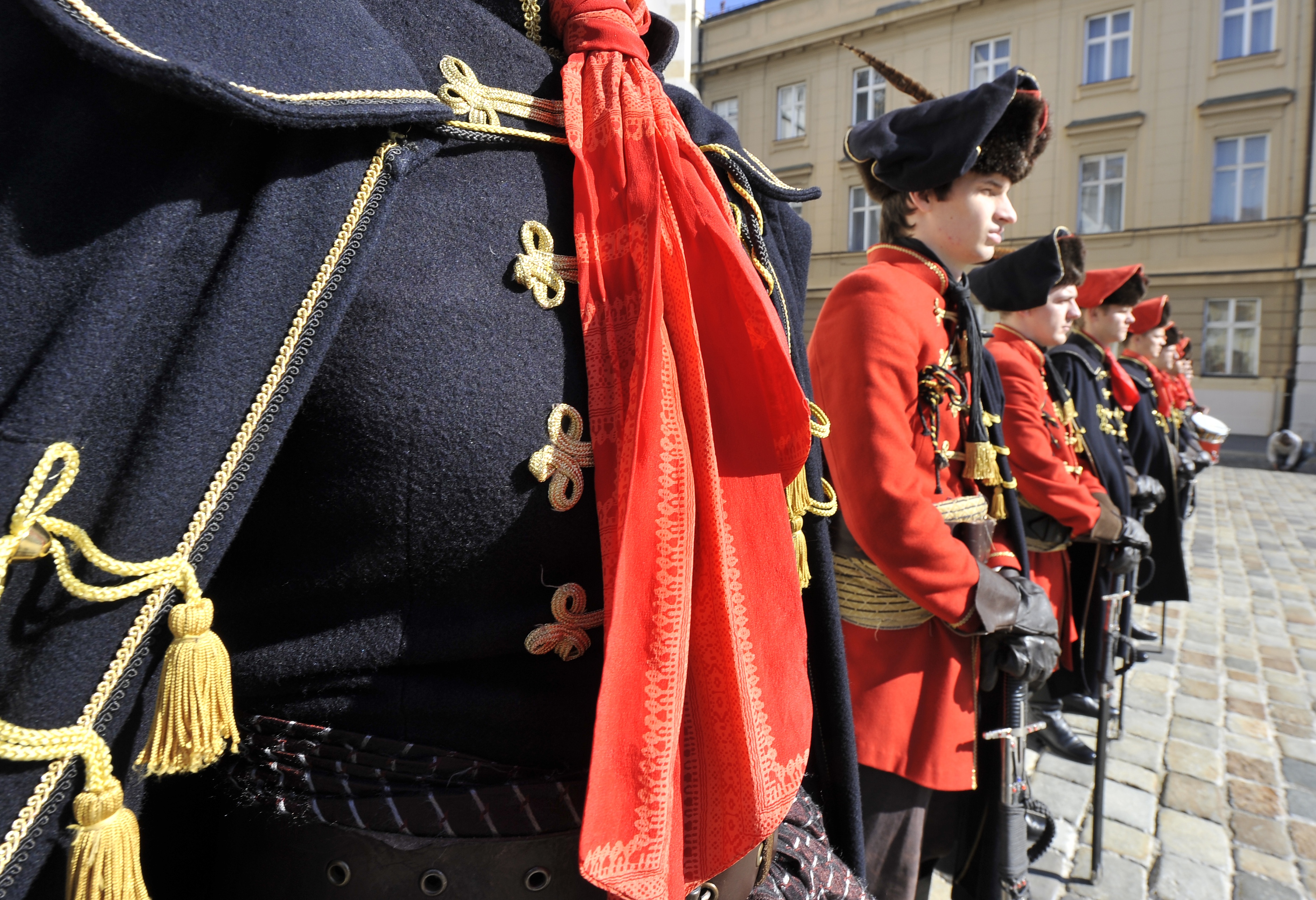 Men dressed in traditional 17th century uniform line up during a ceremony marking the "Cravat Day" in central Zagreb on October 18, 2011.